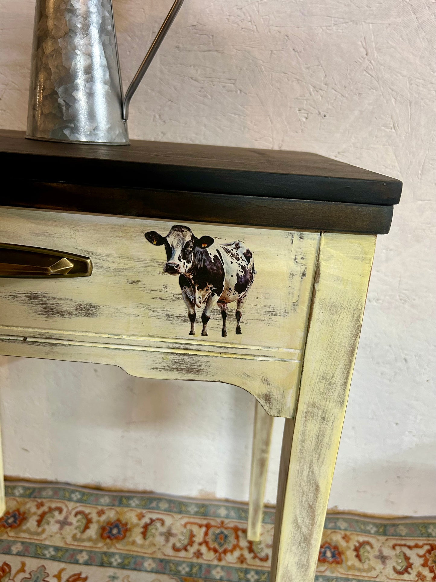 Antique cow-theme sewing table